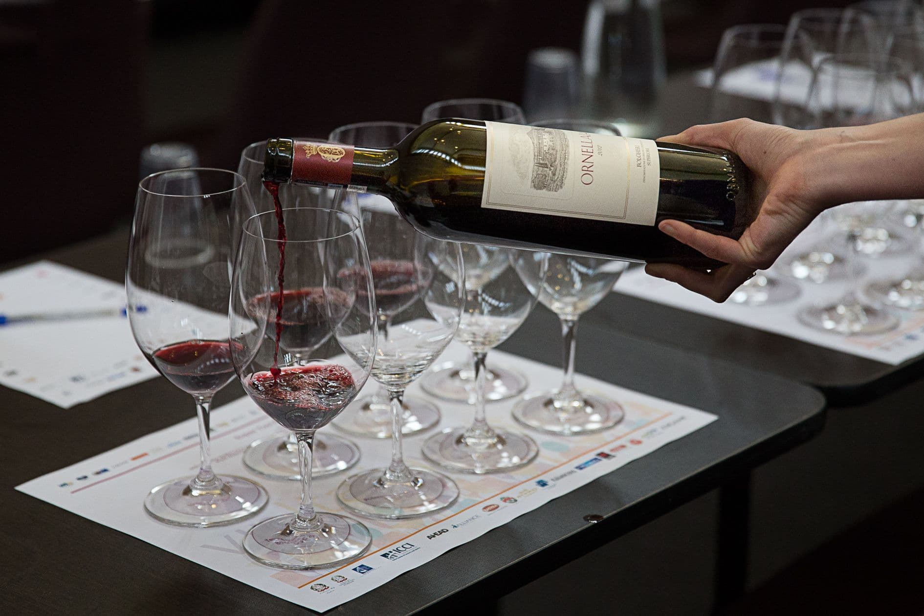 Red wine poured into a tasting glass